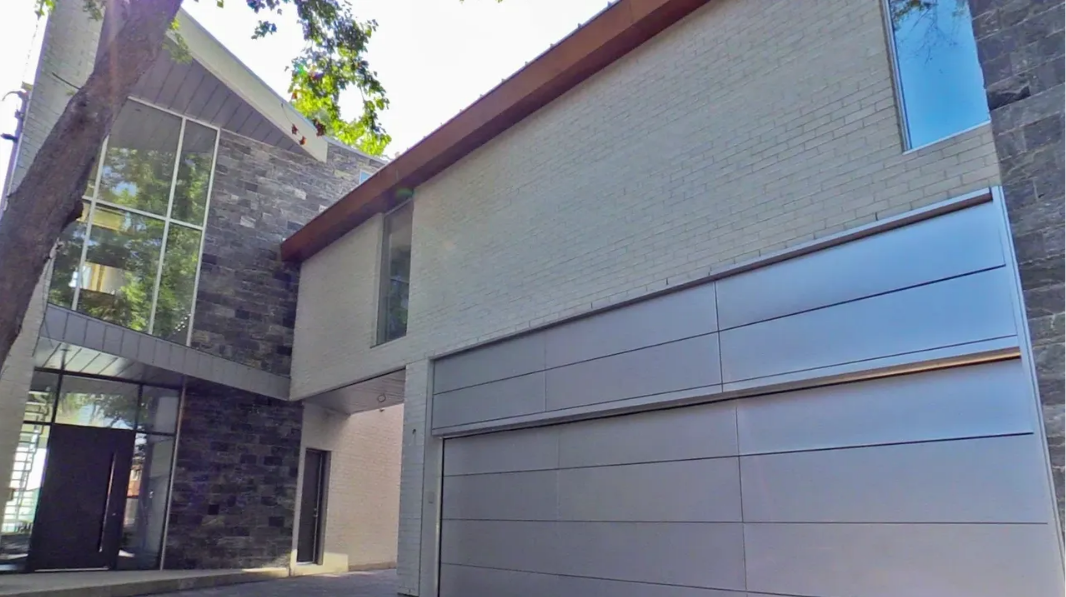 Modern home with stone and glass exterior